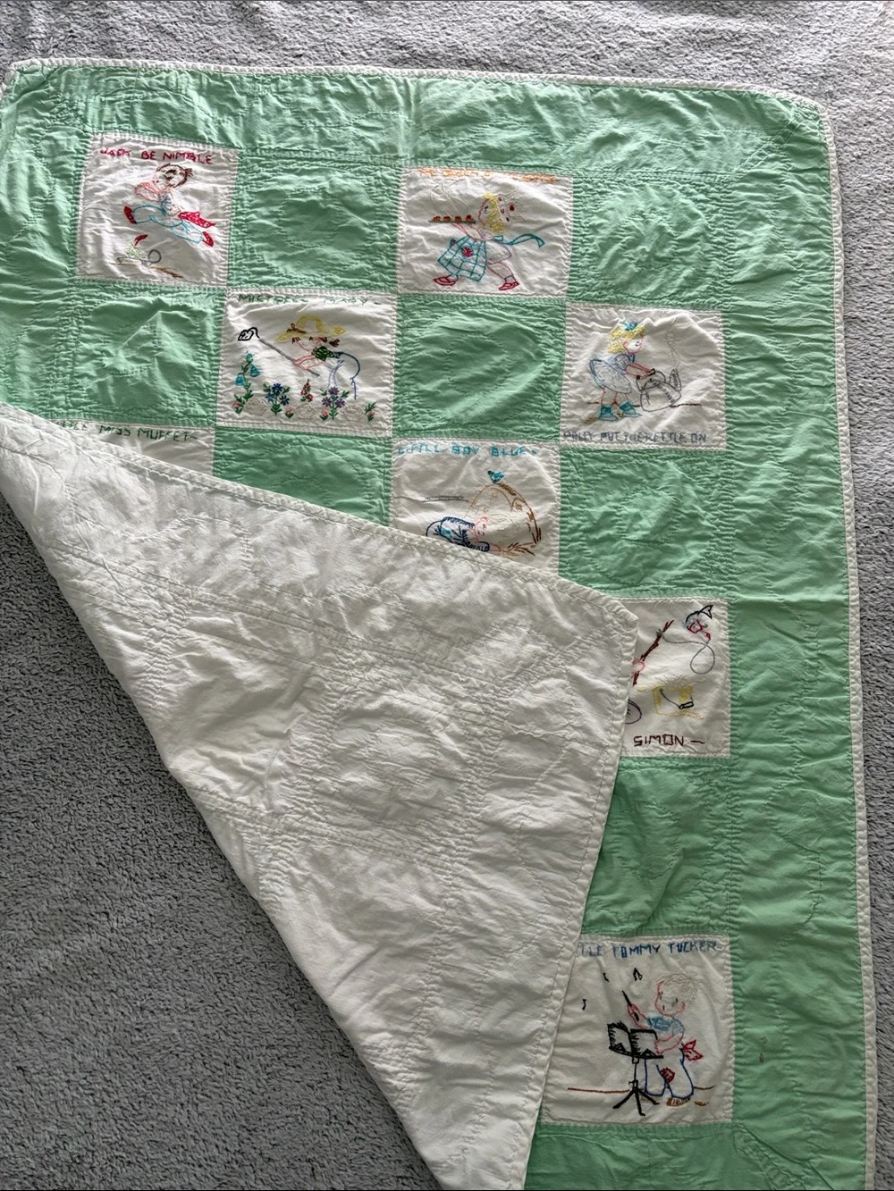 Vintage-Inspired Mint Patchwork Baby Quilt with Embroidered Nursery Rhymes